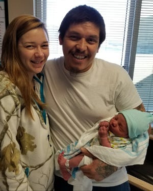 Megan Vegh and Nicanor Garcia hold their newborn baby boy, Isaiah Nicanor Garcia. Isaiah was the first baby born in Cleveland County in 2018. [Special to The Star]