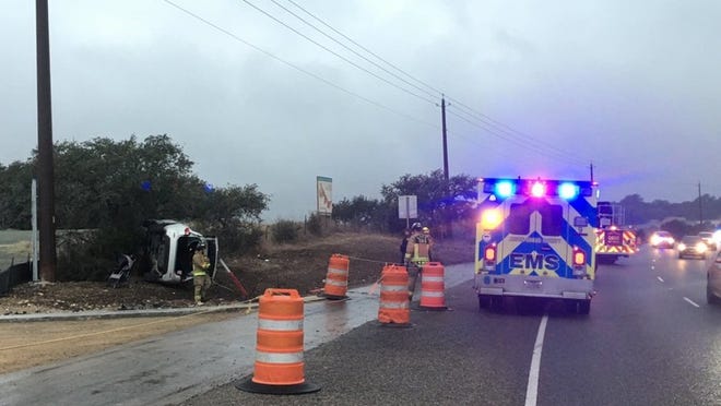Austin-Travis County EMS medics respond to a deadly crash on Texas 71 near Bee Cave during rush hour on Tuesday. Officials said icy roads may have been at least one factor in the crash. Photo courtesy of Austin-Travis County EMS.