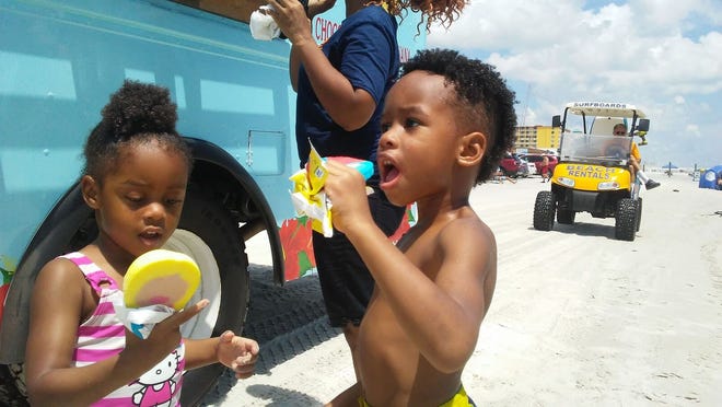 Victoria Poole, 3, and Aiden Poole, 5, cool off with ice cream this summer. News-Journal Dustin Wyatt.