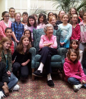 Helen Hansen, the former longtime principal of the old Chemung Hill Elementary School in Stoughton, gets a 95th birthday visit by fifth-grade students in 2012.