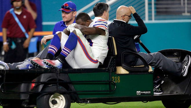 Buffalo Bills running back LeSean McCoy (25) is driven off the field after he was injured during the third quarter Sunday against the Miami Dolphins. (Associated Press)