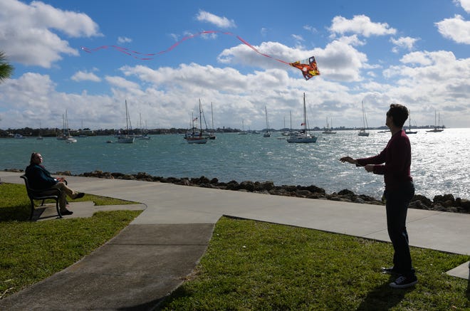 Clearing skies and a crisp breeze inspired Josh Balisciano of Bradenton to fly a kite at Bayfront Park in Sarasota on Wednesday. [Herald-Tribune staff photo / Dan Wagner]
