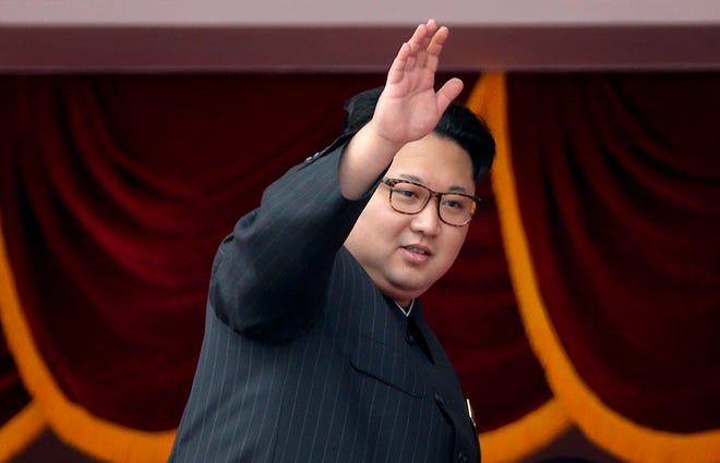 North Korean leader Kim Jong Un waves at parade participants at the Kim Il Sung Square in Pyongyang, North Korea. [AP File Photo/Wong Maye-E)