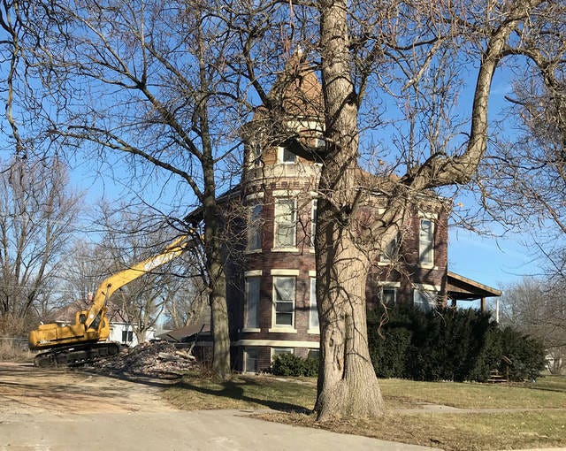 Crews work to tear down the historic home. Contributed photo