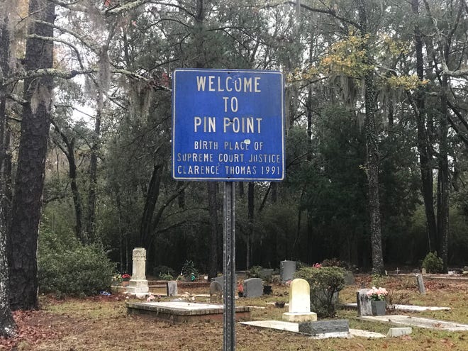 A sign near the Sweetfield of Eden Baptist Church — formerly the Hinder Me Not Baptist Church — greets visitors to Pin Point, a tiny Gullah community south of Savannah, Georgia. (Photo by Rick Holmes)