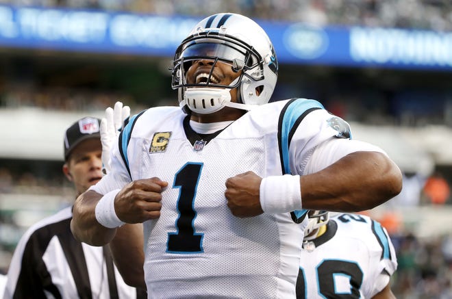 Carolina Panthers quarterback Cam Newton (1) celebrates after scoring on a touchdown run against the New York Jets during the first half of an NFL football game, Sunday, Nov. 26, 2017, in East Rutherford, N.J. (AP Photo/Kathy Willens)