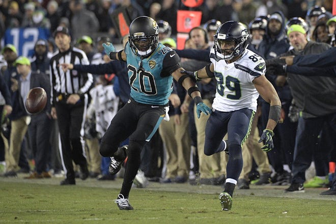 Jacksonville Jaguars cornerback Jalen Ramsey (20) defends a pass intended for Seattle Seahawks wide receiver Doug Baldwin (89) during the second half of a game on Dec. 10 in Jacksonville. The Jaguars won 30-24. [Phelan M. Ebenhack/AP]