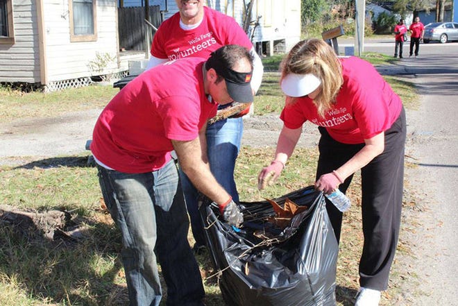Wells Fargo volunteers take part in a neighborhood beautification project at the United Way of Northeast FLorida’s 2017 Martin Luther King Jr. Day of Service. This year’s event is Jan. 15. (Provided by United Way of Northeast Florida)
