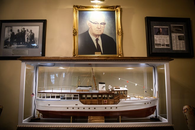A miniature replica of Oscar Breece's boat, The Florida, sits in a glass case at Rogers and Breece Funeral Home on Ramsey Street. [Andrew Craft/The Fayetteville Observer]
