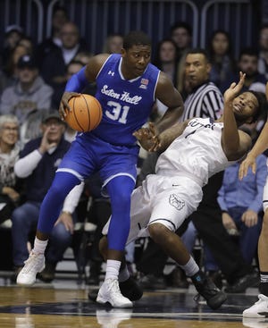 Seton Hall's Angel Delgado is defended by Butler's Tyler Wideman during the first half Saturday, Jan. 6, 2018, in Indianapolis. [Darron Cummings/Associated Press]