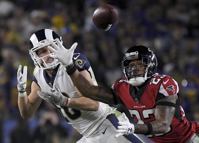 Atlanta Falcons cornerback Robert Alford (right) breaks up a pass intended for Los Angeles Rams wide receiver Cooper Kupp in the second half. [Mark J. Terrill/The Associated Press]