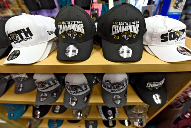 Sports Mania in Jacksonville Beach, FL is doing a brisk business with Jacksonville Jaguars related items as they hit the playoffs for the first time in a long time. Apparel, flags, jewelry, and other memorabilia have been moving out the door as fast as it comes in. (Bob Mack/Florida Times-Union)