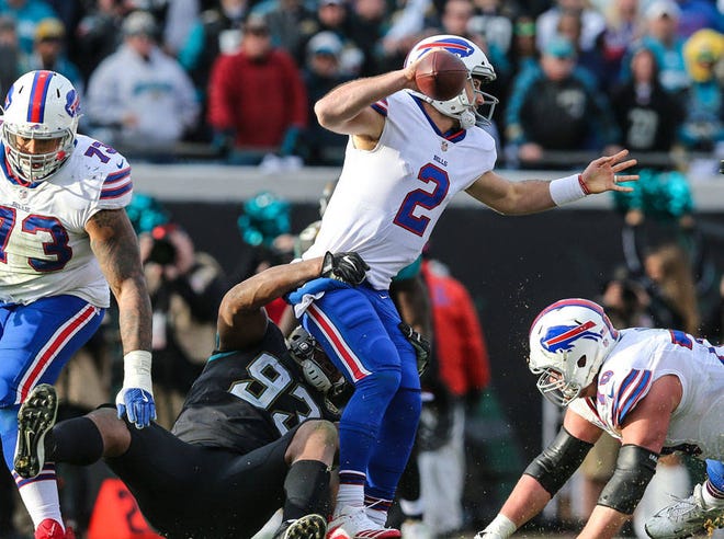Buffalo Bills quarterback Nathan Peterman is penalized for intentional grounding while in the grasp of Jaguars defensive end Calais Campbell. Peterman, who played at Bartram Trail High School, replaced injured Tyrod Taylor in the final minute. (For The Florida Times-Union/Gary Lloyd McCullough)