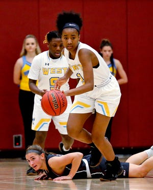 Putnam West's Ce'Nara Skanes, the Big All-City Player of the Year, gets a steal early in the season against Edmond Memorial. [Photo by Steve Sisney, The Oklahoman]