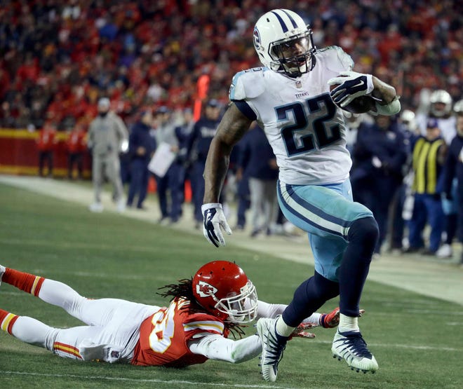 Tennessee Titans running back Derrick Henry (22) runs past Kansas City Chiefs defensive back Ron Parker (38) for a 35-yard touchdown during the second half Saturday in Kansas City, Mo. (AP Photo/Charlie Riedel)