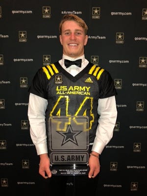Shelby High senior linebacker Dax Hollifield was presented the prestigious 'Doc' Blanchard Award for his on field and academic success at the U.S. Army Bowl awards banquet late Friday night in San Antonio. Hollifield was a captain for the East all-stars in the annual clash of top players from across the country that aired on NBC. [Special to The Star]