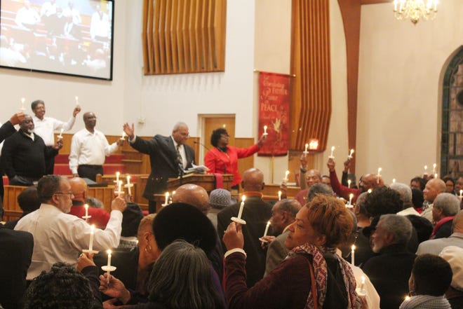 First Baptist Church on Moore Street celebrated its 150th anniversary at a Watch Night service on Dec. 31. Members gathered around the altar to light 150 candles and sing the hymn, “We’ve Come This Far by Faith.” [contributed]
