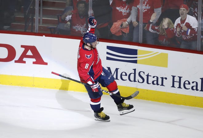 Washington Capitals left wing Alex Ovechkin (8), from Russia, celebrates the only goal of the shootout in a game against the Boston Bruins on Dec. 28, 2017 in Washington. Ovechkin is on pace for 50 goals this season. [AP Photo / Alex Brandon]