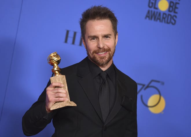 Sam Rockwell holds the award for best performance by an actor in a supporting role in any motion picture for "Three Billboards Outside Ebbing, Missouri," which also was named best drama film, at the 75th annual Golden Globe Awards at the Beverly Hilton Hotel on Sunday, Jan. 7, 2018, in Beverly Hills, Calif. [Photo by Jordan Strauss/Invision/AP]