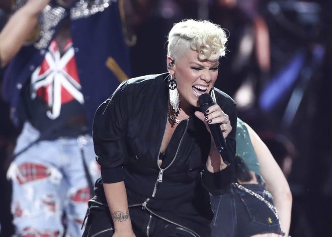 FILE - In this Sept. 22, 2017, file photo, Pink performs at the 2017 iHeartRadio Music Festival Day 1 held at T-Mobile Arena in Las Vegas. NFL announced Monday, Jan. 8, 2018, that the pop star will perform þÄúThe Star-Spangled BannerþÄù before the Big Game on Feb. 4 at U.S. Bank Stadium in Minneapolis. (Photo by John Salangsang/Invision/AP, File)