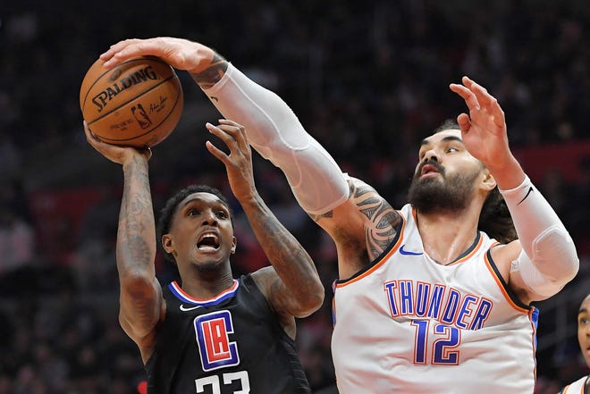 Oklahoma City Thunder center Steven Adams, right, of New Zealand, blocks the shot of Los Angeles Clippers guard Lou Williams during the second half of an NBA basketball game, Thursday, Jan. 4, 2018, in Los Angeles. The Thunder won 127-117. (AP Photo/Mark J. Terrill)