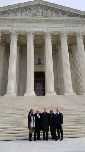 Jamie L. Wine, an attorney with Latham & Watkins, Apalachicola City Attorney Pat Floyd, U.S. Rep. Neal Dunn, Apalachicola Mayor Van Johnson, and Gregory Garre, the attorney for Latham & Watkins on the steps of the U.S. Supreme Court for the Water Wars hearing on Monday, Jan. 8. [Contributed Photo]
