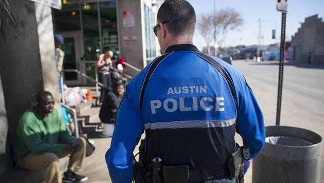 Austin police Cpl. Troy Wismar patrols the Austin Resource Center for the Homeless on Friday.