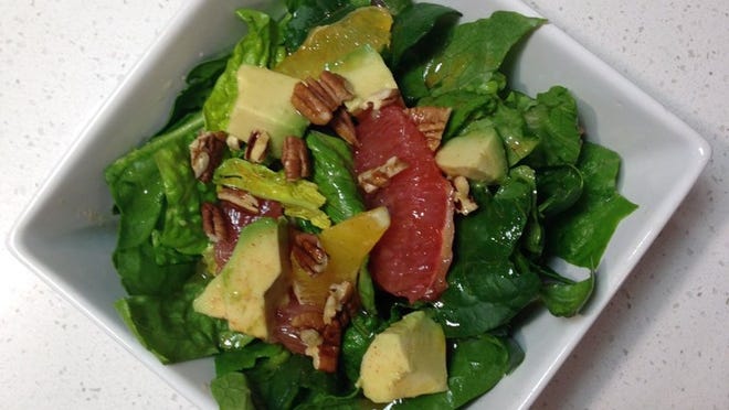 A spinach and winter citrus salad is a great way to use the citrus growing in your mini orchard. Sustainable Food Center