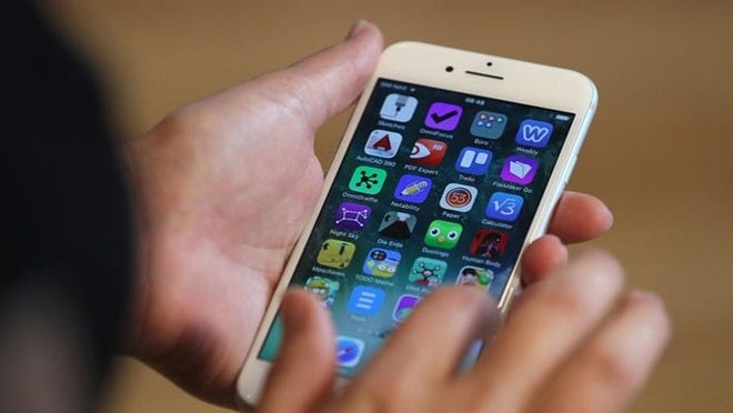 Apple is being sued after it said it slowed down the performances of older iPhones as the batteries in the devices age. Sean Gallup/Getty Images