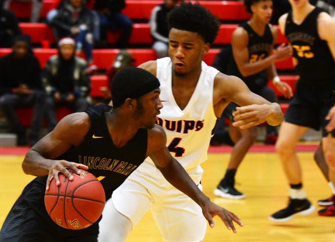 Lincoln Park's Casey Oliver drives past Aliquippa's Gevod Tyson during their game Tuesday at Aliquippa High School. [Lucy Schaly/BCT staff]