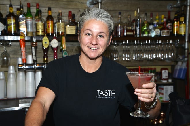 Cherie White said she loves her job and strives to make every customer feel at home when she is behind the bar at Taste in Fort Walton Beach. [SAVANNAH VASQUEZ/DAILY NEWS]