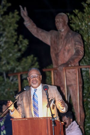 City Councilman D.J. Haire speaks to the crowd in remembrance of Dr. Martin Luther King Jr. during a candlelight vigil held at Martin Luther King Park on Tuesday, January 9, 2018. [Raul F. Rubiera/The Fayetteville Observer]