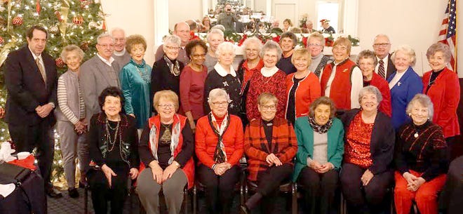 Volunteers and staff of the John and Annie Glenn Museum honored recently at the Cambridge Country Club are, left to right, seated, Clyta Young, Jean McKendry, Paula Gray, Bev Allen, Betty Smith, Rich Mitchell, Joan Neff; row 2, Rick Booth, Sylvia Bates, George St. Clair, Carole Montague, Jane Castor, Yvonne Williams, Sally Brixner, Mary Jo Moody, Mary Ann DeVolld, Julia Swan, Joan Hoon, Carolin Parks, Joy Murrey; back row, Rudy Gerlach, David Huston, Sandy Harstine, Joan Stewart, Emily Meehan, Amy Kilpatrick and Ron Vessels.