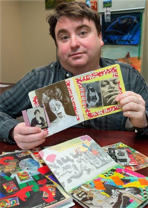 Jon Foster displays samples of some of the mail art books, postcards and flyers he has made and/or collaborated and exchanged with other mail artists from various cities and countries. [Donnie Roberts/The Dispatch]