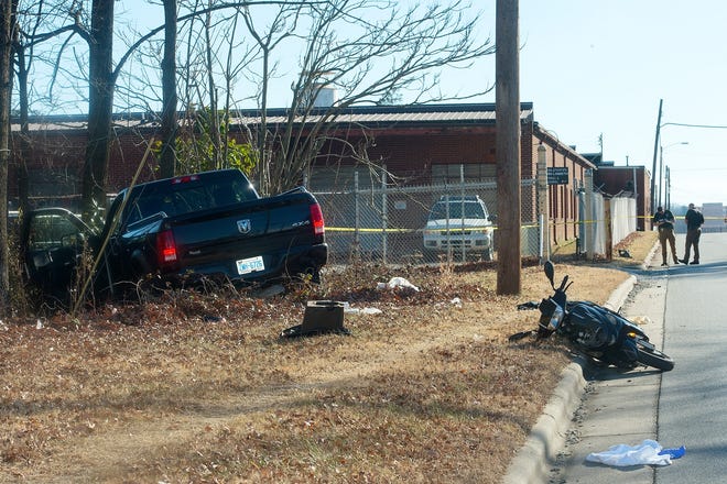 Thomasville Police investigate a crash scene on Julian Drive that involved a moped alledgedly driven by a jewelry store robbery suspect on Tuesday afternoon. [Donnie Roberts/The Dispatch]