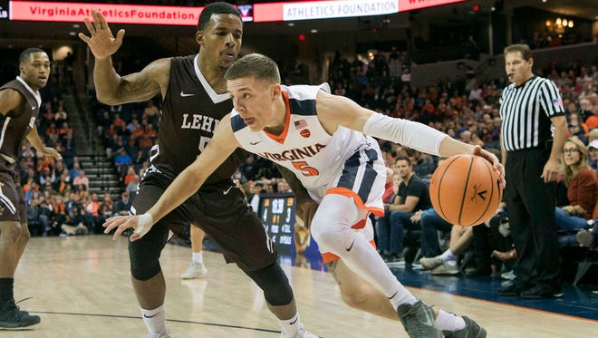 Virginia’s Kyle Guy (5) leads the Cavaliers in scoring with 14.9 points per game. (AP Photo/Lee Luther Jr., File)