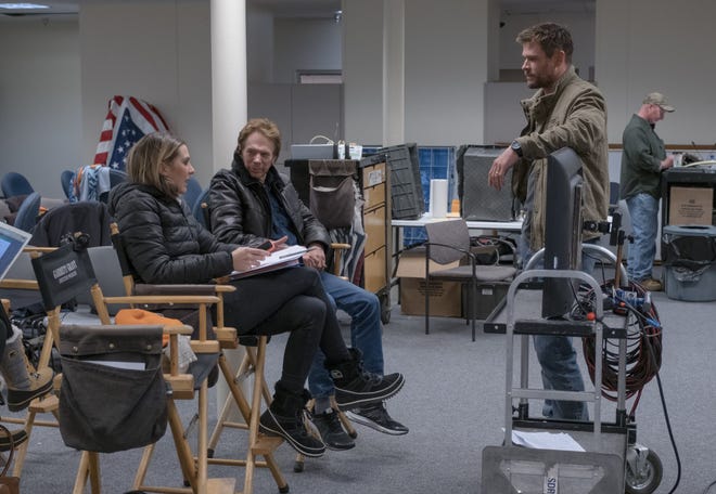Jerry Bruckheimer (center) talks with producer Molly Smith and star Chris Hemsworth. [Warner Bros. Pictures]