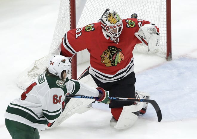 A shot by Minnesota Wild's Jonas Brodin scores past Chicago Blackhawks goaltender Anton Forsberg during the second period of the game Wednesday, Jan. 10, 2018, in Chicago. [CHARLES REX ARBOGAST/THE ASSOCIATED PRESS]