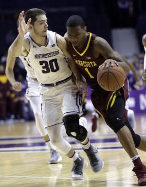Minnesota guard Dupree McBrayer, right, drives against Northwestern guard Bryant McIntosh during the first half of the game Wednesday, Jan. 10, 2018, in Rosemont. [NAM Y. HUH/THE ASSOCIATED PRESS]