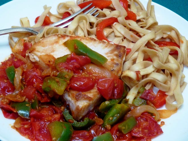Swordfish in a spicy sofrito sauce captures the flavors of Spain. (Linda Gassenheimer/TNS)