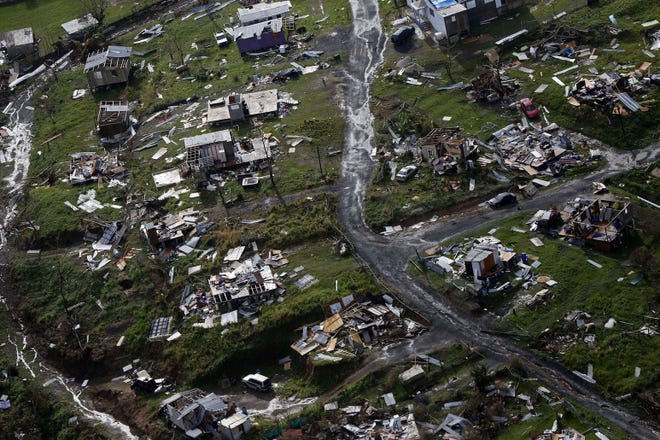 Hurricane Maria took a big toll on Puerto Rico. [Gerald Herbert/The Associated Press]