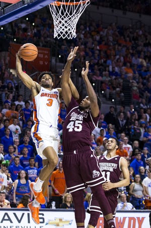 Florida guard Jalen Hudson goes up for a layup Wednesday while Mississippi State's E.J. Datcher attempts to block him at the O'Connell Center. The Gators beat the Bulldogs 71-54. [LAUREN BACHO/THE GAINESVILLE SUN]