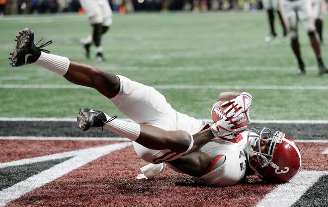 Alabama's Calvin Ridley celebrates his touchdown catch that tied Georgia in the fourth quarter of the national championship game, eventually won by the Crimson Tide in overtime. [AP PHOTO]