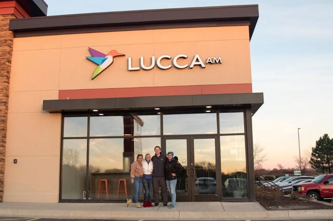 Kevin Lucca, owner of Lucca Alla Moda, stands with his employees. [PHOTO PROVIDED]