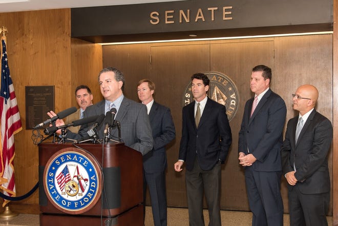 Chief Financial Officer Jimmy Patronis and Agriculture Commissioner Adam H. Putnam, along with Sen. Jeff Brandes, R-St. Petersburg, and Rep. Shawn Harrison, R-Tampa, on Wednesday urged lawmakers to eliminate the credit report freeze fee during the 2018 legislative session. [CONTRIBUTED PHOTO]