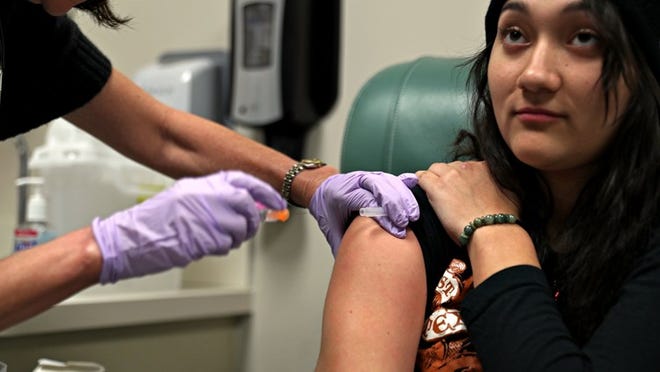 Jasmine Bernal of Kyle prepares to get injected with a flu shot at the Seton Medical Mission at Seton Medical Center on Jan. 28, 2017. Daulton Venglar/AMERICAN-STATESMAN
