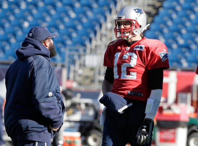 New England Patriots defensive coordinator Matt Patricia, left, and quarterback Tom Brady, right, speak during an NFL football practice, Wednesday, Jan. 10, 2018, at Gillette Stadium, in Foxboro.