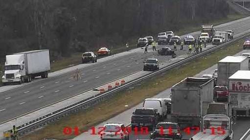 The crash scene at 11:45 a.m. on I-95 north just past Florida 207 shows emergency vehicles and clean-up crews still on the scene more than seven hours after the fatal incident occurred. (FL511.com)