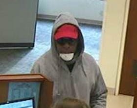 A man is caught on camera robbing Associaetd Bank, 4400 Center Terrace, on Tuesday, Jan. 9, 2018. [PHOTO PROVIDED]
