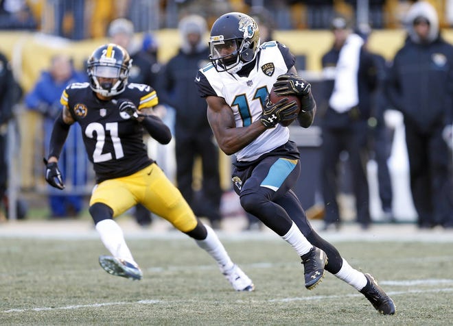 Jacksonville Jaguars wide receiver Marqise Lee (11) runs after catching a pass from quarterback Blake Bortles in Sunday’s 45-42 win against the Steelers. (AP Photo/Keith Srakocic)